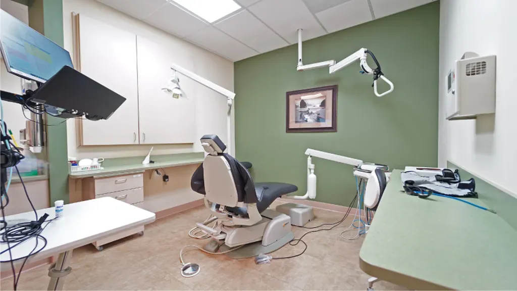 The Humana logo in bright green text - Dentist University Place WA